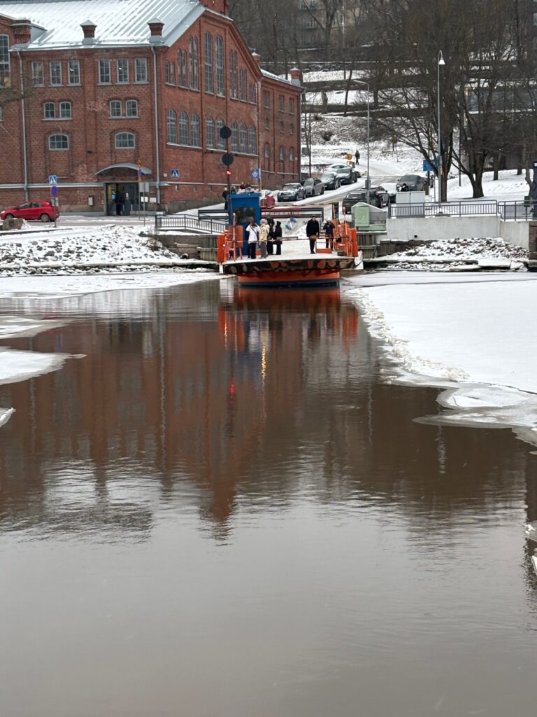 a boat on a river with people on it