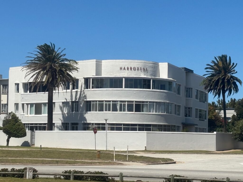 a building with palm trees in front of it
