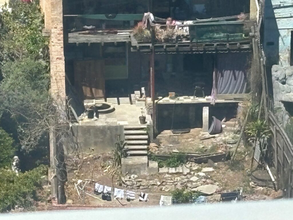 a building with a balcony and stairs