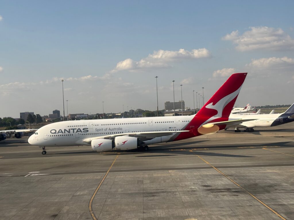 a large white airplane on a runway