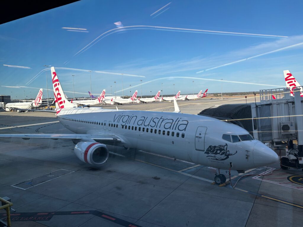 a group of airplanes on a runway