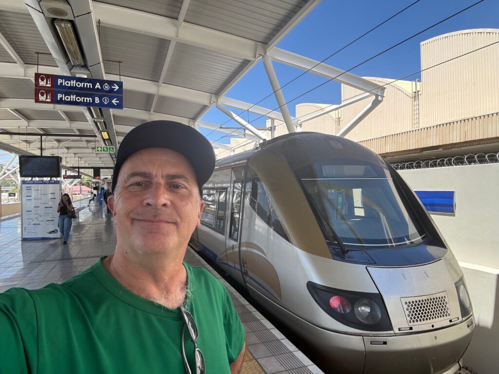 a man standing in front of a train