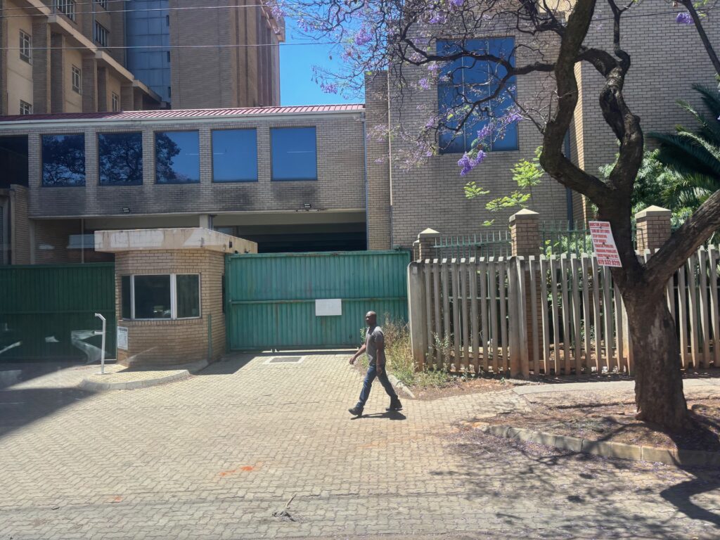 a man walking on a brick road