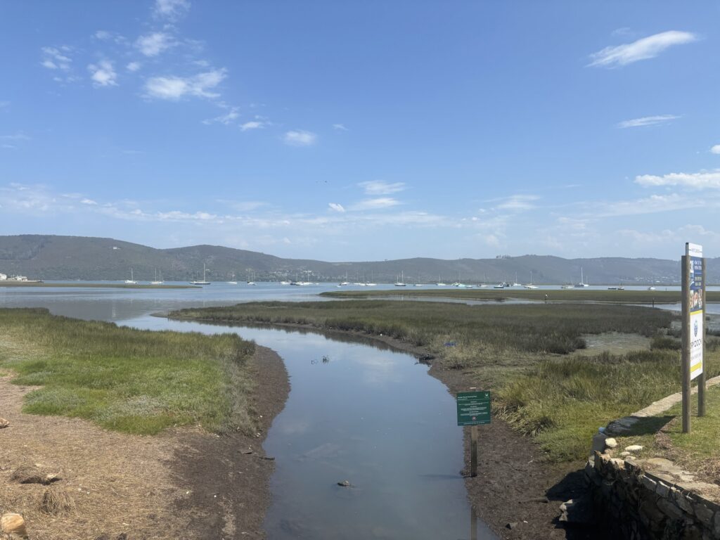 a water way with boats in the background